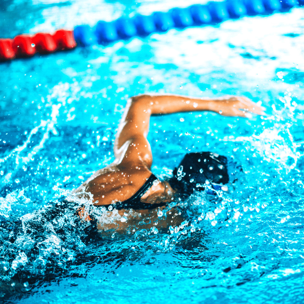female swimming in pool lane