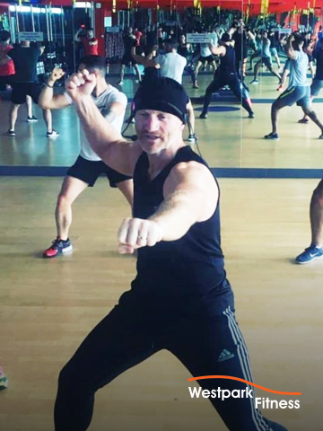cardio kickboxing at westpark fitness held in gym studio with wooden floor and mirrored walls