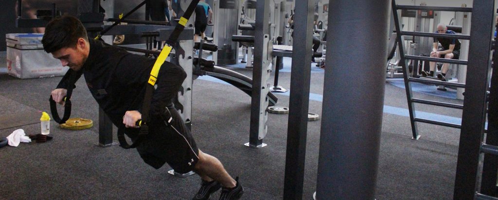 trx in dublin male trainer completing trx pushup exercise