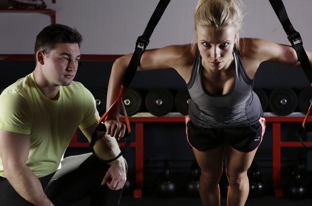trx in dublin female trainer completing trx pushup exercise