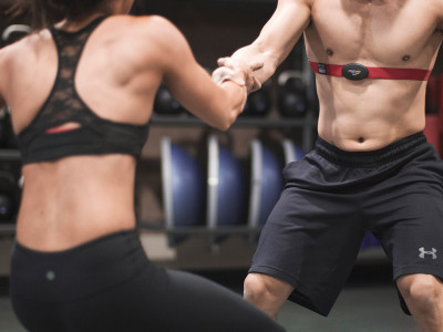 man and woman exercising in gym