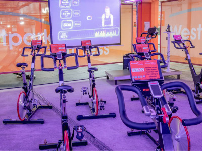 spin bikes in a spin studio with colourful lighting