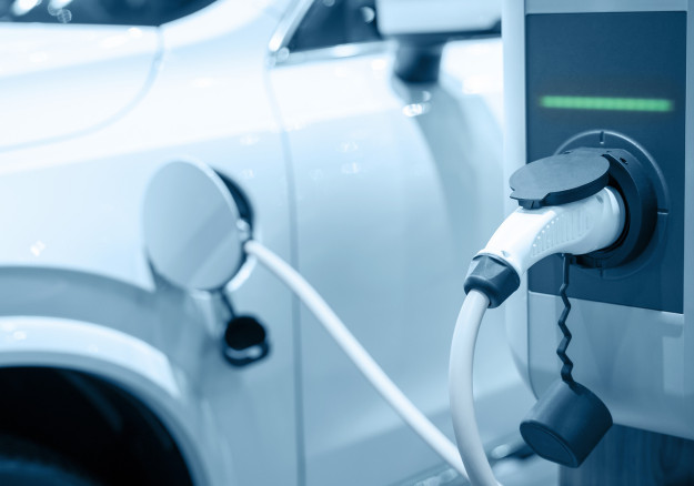 close up of car being charged with electricity